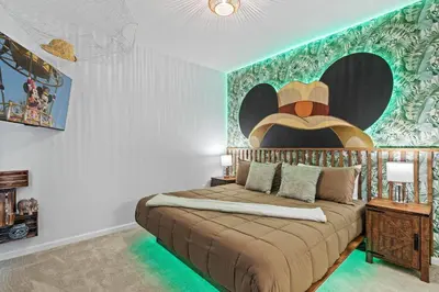 a bedroom with a bed with a cowboy hat on the wall at Paradiso Grand Resort 6 bedroom in Orlando
