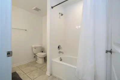 a bathroom with a white tub and a toilet at Storey Lake Resort 1250 - Hosted by Top Villas in Kissimmee