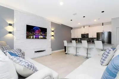 a living room with a white brick wall at Storey Lake Resort 363 - Hosted by Top Villas in Kissimmee
