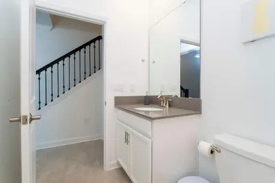 a bathroom with a sink and a mirror at Storey Lake Resort 363 - Hosted by Top Villas in Kissimmee
