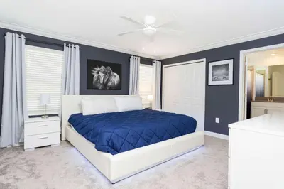 a bedroom with a bed and a ceiling fan at Storey Lake Resort 363 - Hosted by Top Villas in Kissimmee