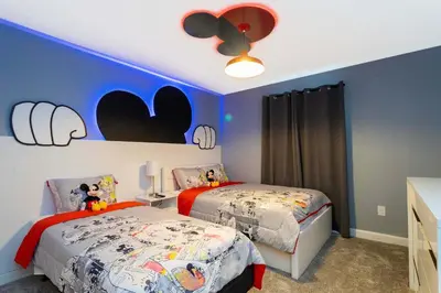 a bedroom with two beds and a ceiling fan at Storey Lake Resort 363 - Hosted by Top Villas in Kissimmee