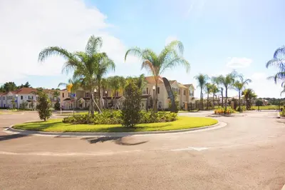 a roundabout with palm trees in a parking lot at Corner Villa in West Lucaya – Your Ideal Getaway in Kissimmee