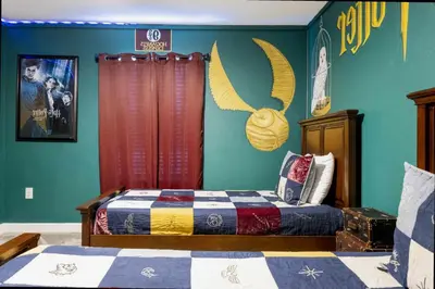 a bedroom with a bed with a checkered blanket at Stunning 4Bd Close to Disney with Pool at Storey Lake 4369 in Kissimmee