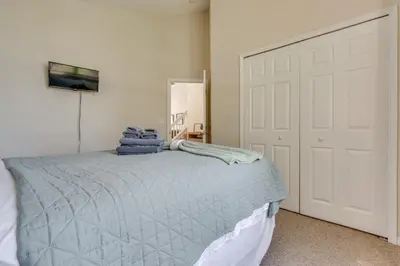 a bedroom with a bed and a white door at 15 Mi to Universal Home with Pool in Kissimmee