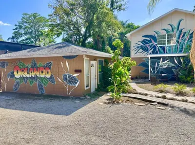 a house with a mural on the side of it at Lakefront Guest House By Downtown, Boat, Fishing in Orlando