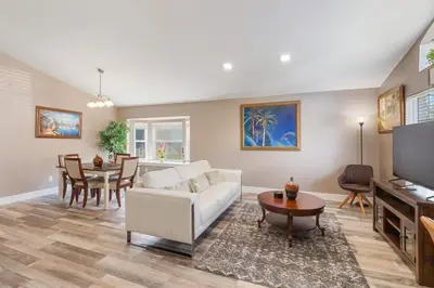 a living room with a white couch and a table at Vacation Home near Disney World! in Kissimmee