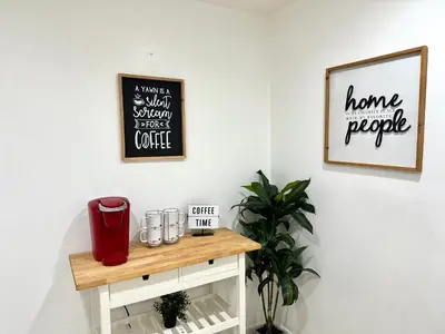 a room with a table with a coffee maker on it at Modern 2BR Lakeview Near Orlando Airport Free Parking in Orlando