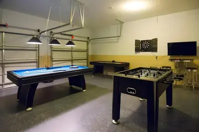 a room with two tables and a pool table at Free Water Park 4BR wPool Game Room 7739TB in Orlando