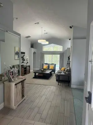 a living room with a couch and a table at Family Dream Home Near Disney in Kissimmee