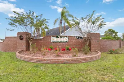 a brick building with a sign that reads sirmania at Cozy Home Near Disney!!! in Kissimmee