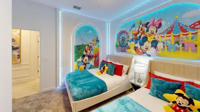 a bedroom with a mickey mouse themed bedroom at Storey Lake Resort 1119 - Hosted by Top Villas in Kissimmee