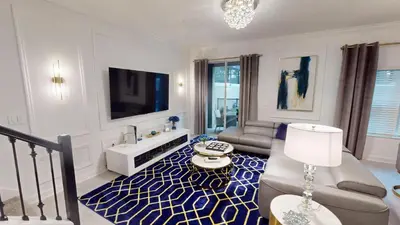 a living room with a couch and a tv at Storey Lake Resort 1119 - Hosted by Top Villas in Kissimmee