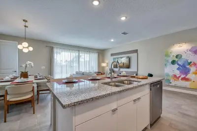 a kitchen with a sink and a dining room at Formosa Valley Resort 59 - Hosted by Top Villas in Orlando