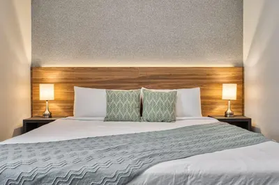 a bedroom with a large white bed with two lamps at Formosa Valley Resort 60 - Hosted by Top Villas in Orlando