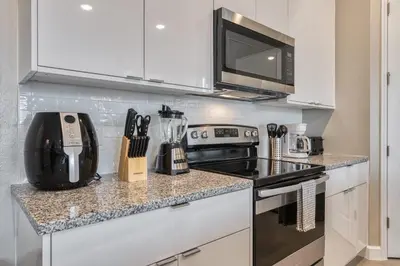 a kitchen with a stove and a microwave at Formosa Valley Resort 62 - Hosted by Top Villas in Orlando
