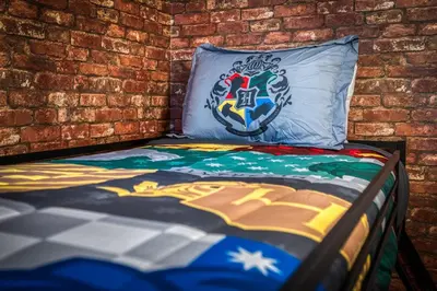 a bed in a room with a brick wall at Formosa Valley Resort 62 - Hosted by Top Villas in Orlando