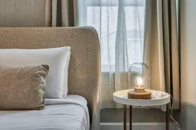 a bedroom with a bed and a table with a candle on it at Formosa Valley Resort 62 - Hosted by Top Villas in Orlando