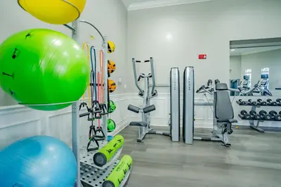 a fitness room with treadmills and exercise equipment at Vista Cay 239 - Hosted by Top Villas in Orlando