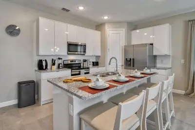 a kitchen with a large island with a counter top at Formosa Valley Resort 58 - Hosted by Top Villas in Orlando