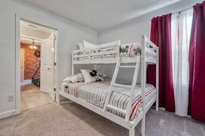 a white bedroom with two bunk beds in it at Formosa Valley Resort 63 - Hosted by Top Villas in Orlando