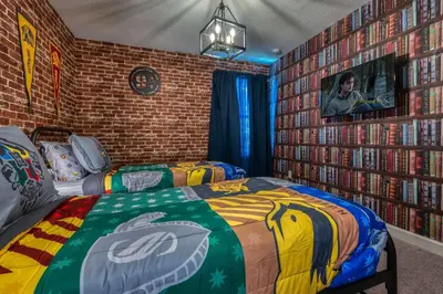 a bedroom with two beds and a brick wall at Formosa Valley Resort 64 - Hosted by Top Villas in Orlando