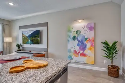 a kitchen with a counter and a painting on the wall at Formosa Valley Resort 64 - Hosted by Top Villas in Orlando