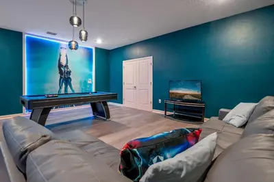 a living room with a couch and a flat screen tv at Storey Lake Resort 1120 - Hosted by Top Villas in Kissimmee