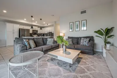 a living room with a couch and a table at Storey Lake Resort 1059 - Hosted by Top Villas in Kissimmee