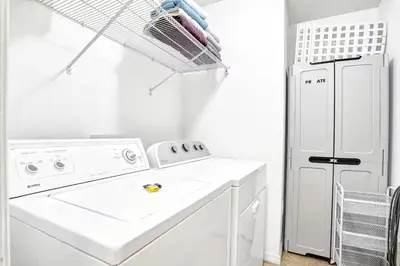 a white laundry room with a washer and dryer at LB4701PL - 4 Beds villa - with pool and game room in Kissimmee