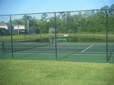 a tennis court with two tennis courts at LB4701PL - 4 Beds villa - with pool and game room in Kissimmee