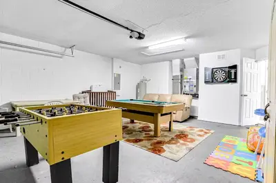 a living room with two ping pong tables in it at LB4701PL - 4 Beds villa - with pool and game room in Kissimmee