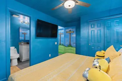 a blue bedroom with a teddy bear on a bed at Free Arcade! All Rooms Themed! South Facing Pool! in Orlando