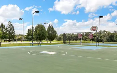 a basketball court with a basketball hoop at 4 Bedroom 3 Bathroom Villas At SevenDwarfs 27-108 in Kissimmee