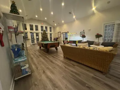 a living room with couches and a pool table at 4 Bedroom 3 Bathroom Villas At SevenDwarfs 27-108 in Kissimmee