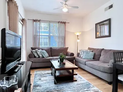 a living room with a couch and a tv at Cute and Cozy 4Bed Townhome Venetian Bay-2200SCD in Kissimmee