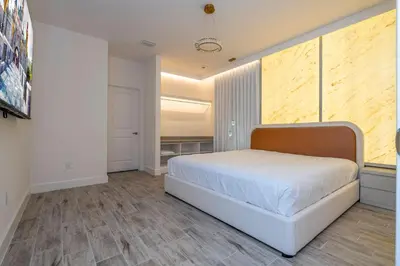 a bedroom with a large bed in a room at BRAND NEW 15Bed Home wprivate Pool 5824 in Orlando
