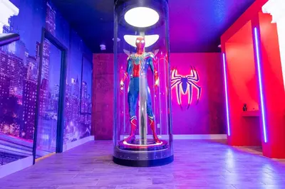 a statue of a man in a clock in a room at BRAND NEW 15Bed Home wprivate Pool 5824 in Orlando