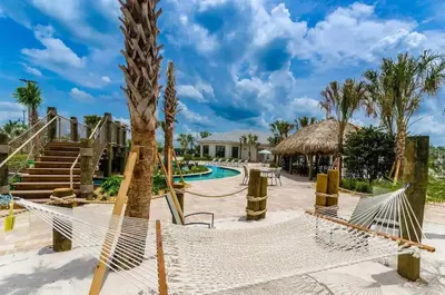 a resort with a hammock and a swimming pool at Waterpark Disney wPoolLakeView Storey Lake in Kissimmee