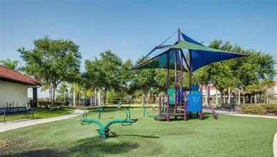 a park with a playground with a large kite at Disney Area Retreat 6BR4BA with Private Pool Theater Game Room Bella Vida Resort BV4509 in Kissimmee