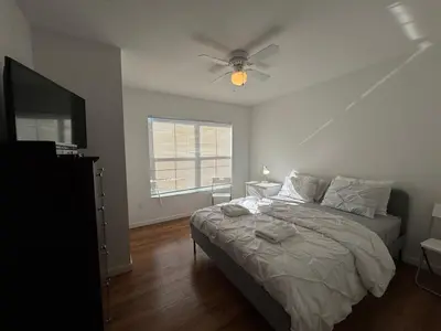 a bedroom with a bed and a ceiling fan at 3 Bedroom 2 Bathroom Villas At SevenDwarfs 8-103 in Kissimmee