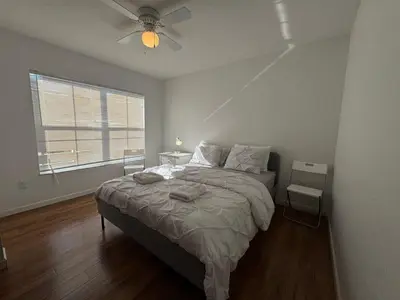 a bedroom with a bed and a ceiling fan at 3 Bedroom 2 Bathroom Villas At SevenDwarfs 8-103 in Kissimmee
