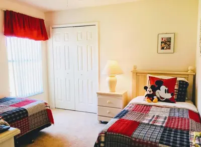 a bedroom with a bed with a stuffed animal on it at Hidden Waterfront Oasis - 18 Minutes To The Disney in Orlando