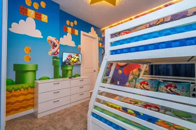 a childs bedroom with a bunk bed at Luxury 3BR home with Mario Bros Room Near Disney in Orlando