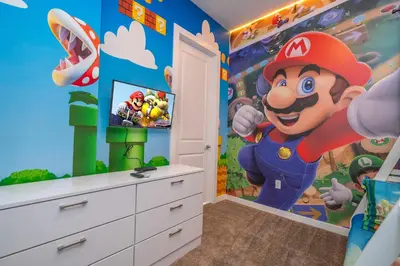 a mario room with a mario game mural on the wall at Luxury 3BR home with Mario Bros Room Near Disney in Orlando