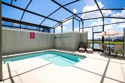 a swimming pool in a building with a glass ceiling at Great Home Mickey & Harry Potter Beds Top Spot in Kissimmee