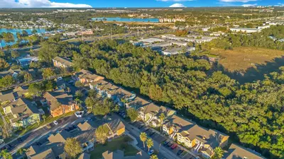 an overhead view of a town with houses and trees at Familiar Retreat with Resort Access Near Disney in Kissimmee