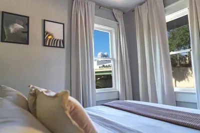a bedroom with a bed and a window at Historic orlando Casita Joy, DT, Lake Eola, Delaney park, 2 bedrooms 1 bathroom Unit B in Orlando