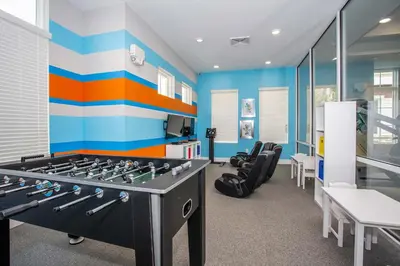 a room with a gym with blue and orange stripes at Stylish 4Bed Townhome at Summerville Near Disney in Orlando
