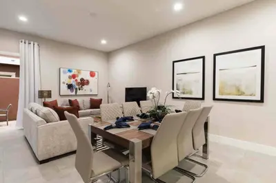 a living room with a table and a couch at Stylish 4Bed Townhome at Summerville Near Disney in Orlando
